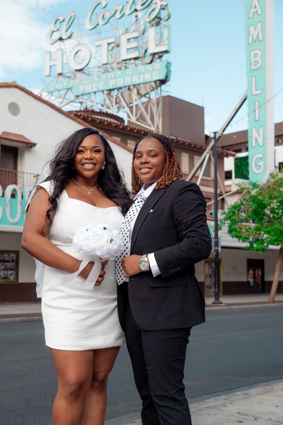Newlyweds on Fremont with the El Cortez sign behind them
