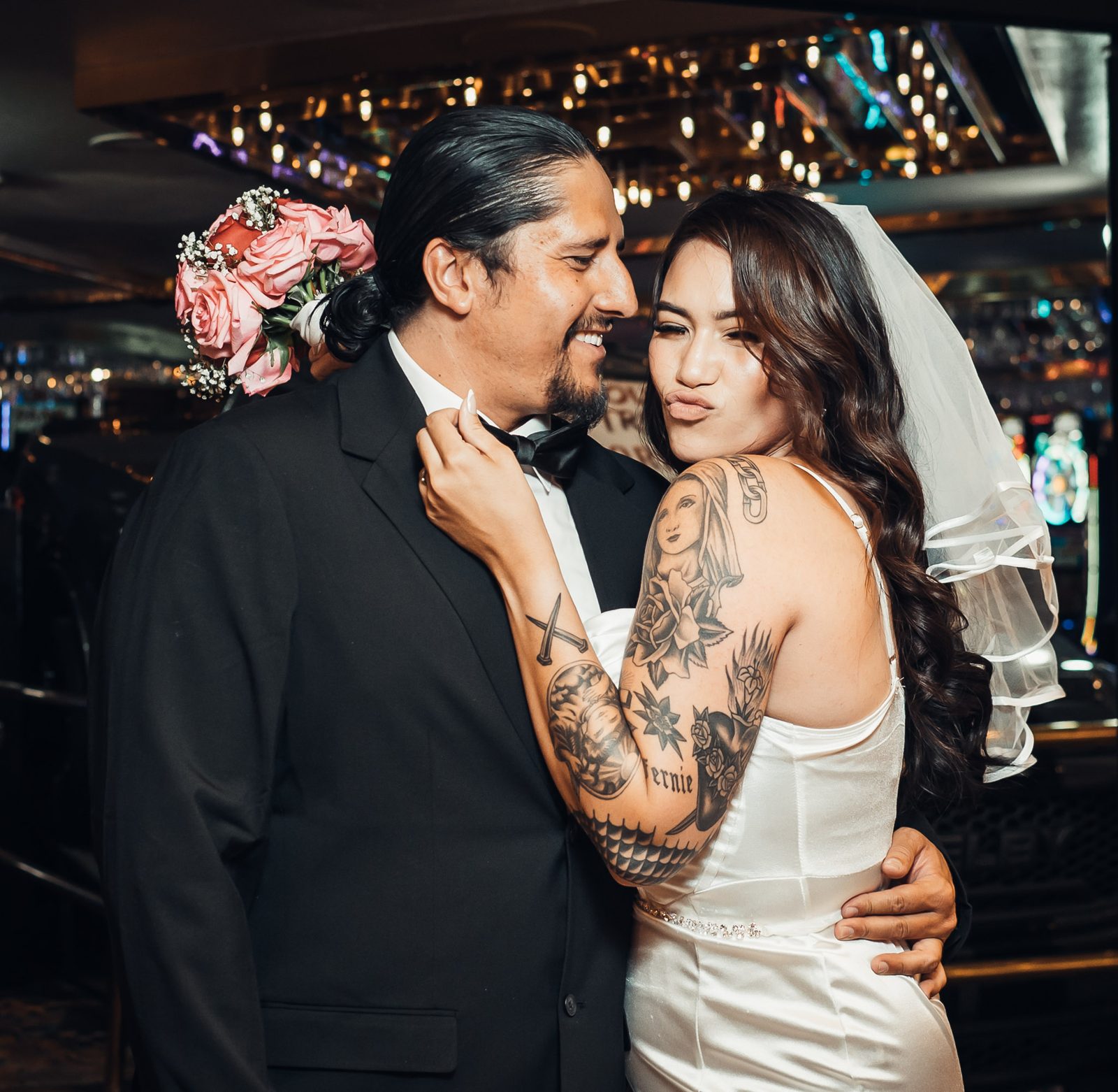 Newlyweds embracing on the casino floor