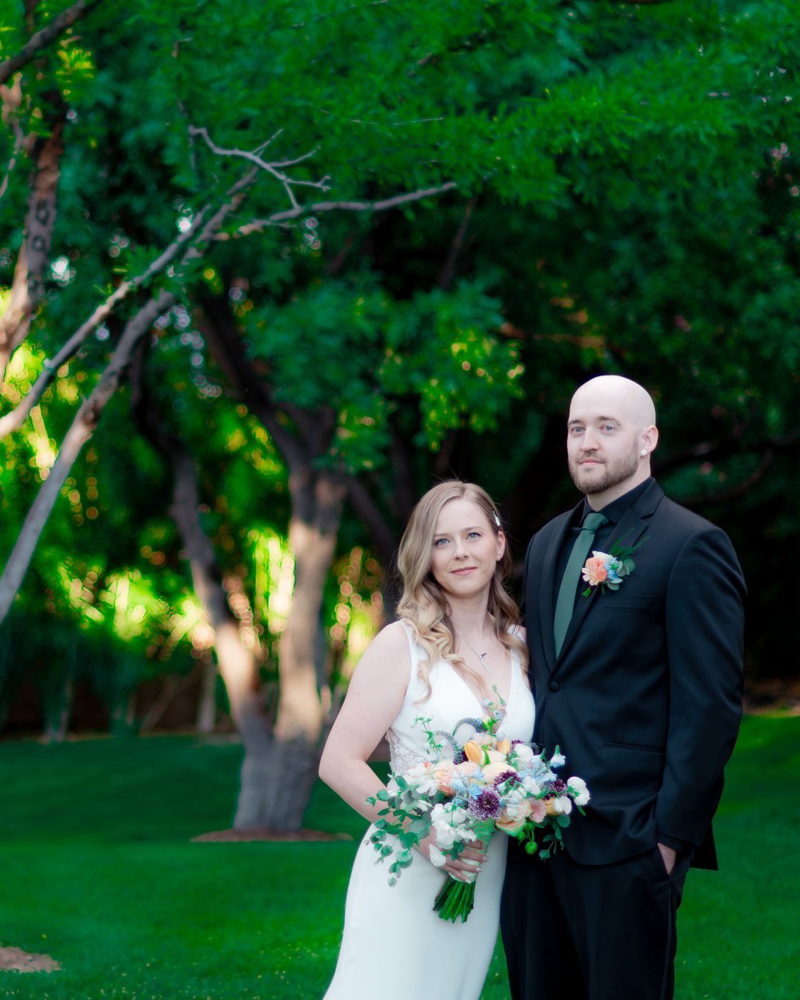 Bride and groom portrait among the trees
