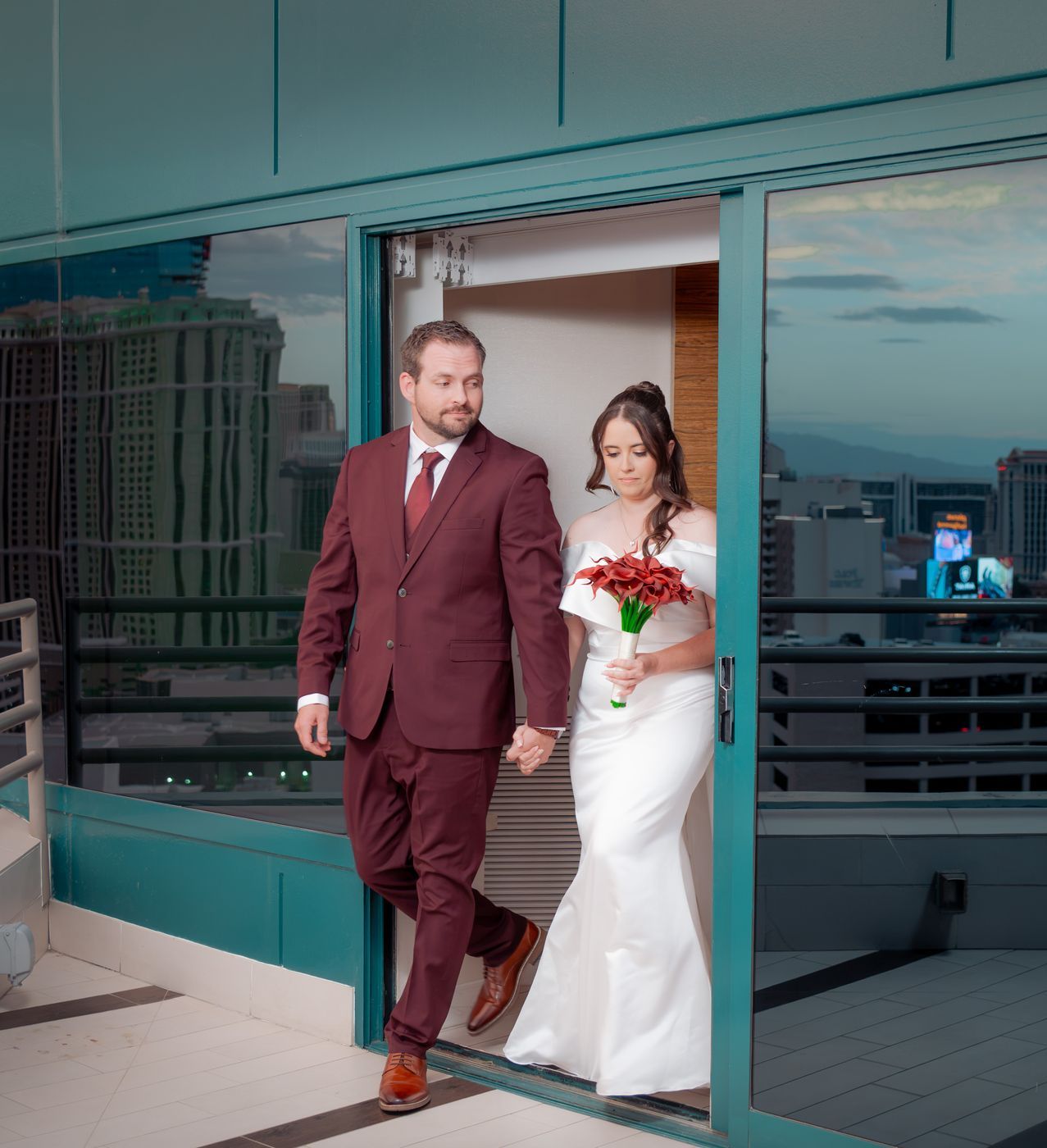 Bride and groom step out onto the rooftop terrace