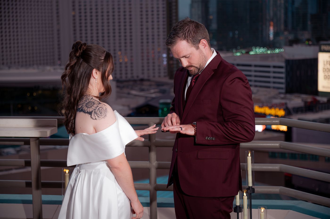 Groom placing the ring on the bride during the rooftop ceremony